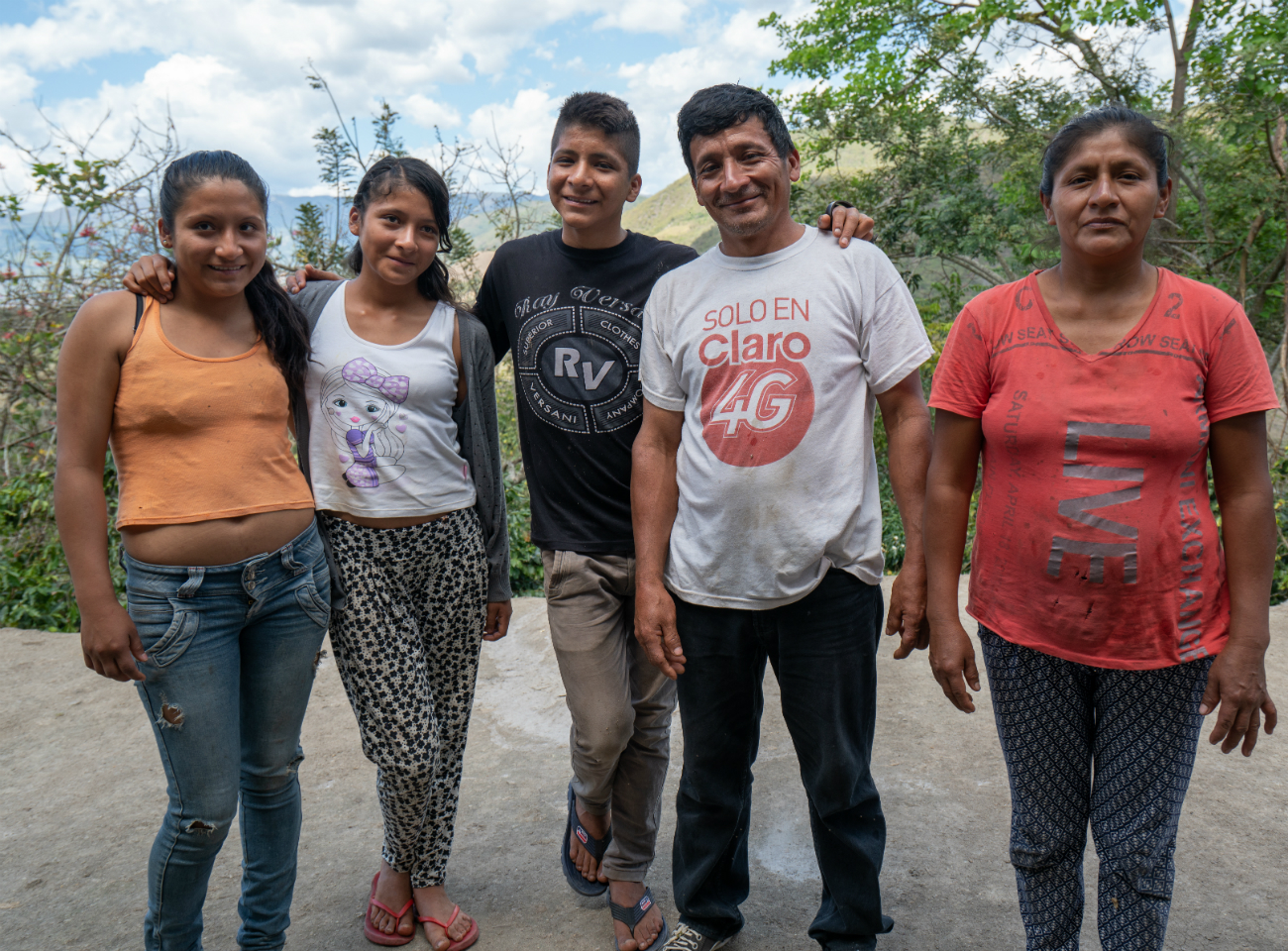 A Peruvian coffee farmer and his family